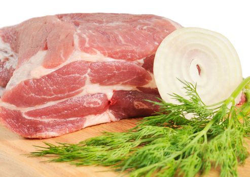 Piece of pork for roasting on a wooden board. Isolated on white.