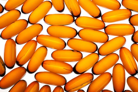 Translucent  vitamin gel capsules filling frame.