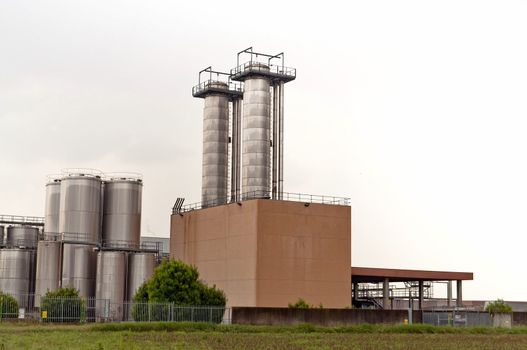 Modern Industry dairy complex with silos on white background