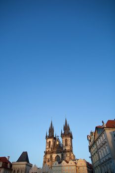 View of the Church of Our Lady before Týn (Tyn Church) and the houses of the Old Town Square in Prague at dusk
