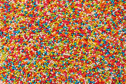 Background of colorful sprinkles, jimmies for topping on ice cream or cake