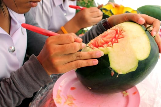 Thai students are carving the water melon