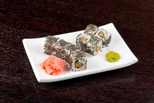 Closeup of Sushi rolls at plate with sesame