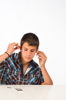 Teenager listening to music with a media player