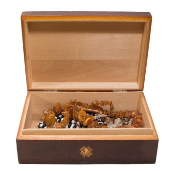 opened old chest with jewellery inside, on white background