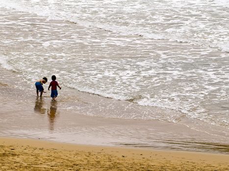 Kids playing on the beach in Malta in the Mediterranean