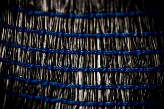 Close-up photo of the weave of a straw broom