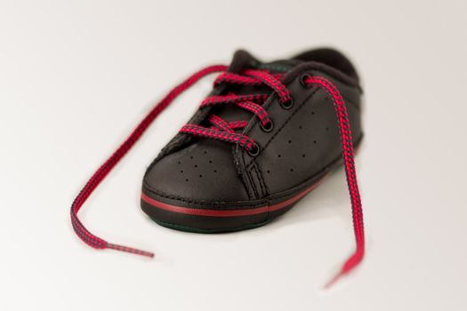 Single small black and red toddlers right shoe