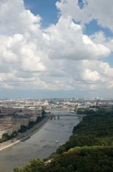 City and white clouds in a blue sky