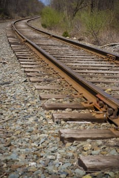 Railroad tracks curving off into the distance ahead.