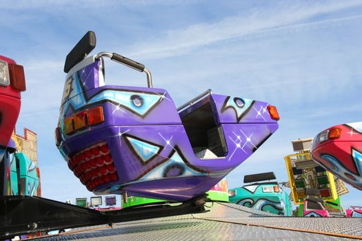 Car in a fun fair carousel