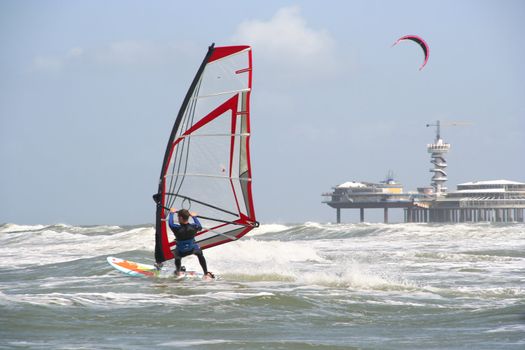 Wind surfer with background of pier at Scheveningen, Holland