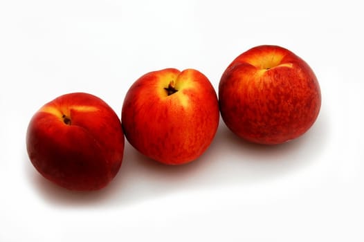 three peaches isolated on the white background