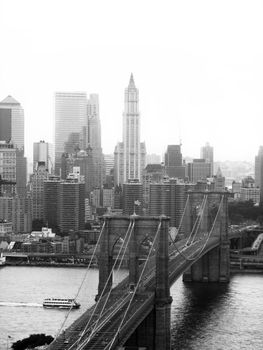 A shot of the brooklyn bridge in New York City - black and white.