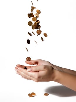 coins fall into his hands on white background