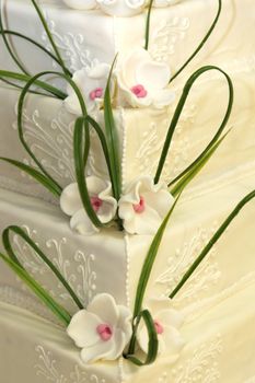Wedding cake or birthday cake decorated with marzipan roses, close-up