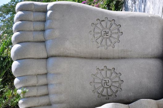 Closeup view of stone-carved buddha feet