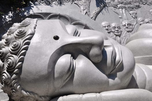 Closeup view of a historic lying buddha statue