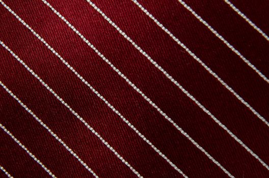 Closeup view of a striped neck tie, could be used as a background.