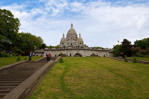 Sacre coeur with stairs and grass in front