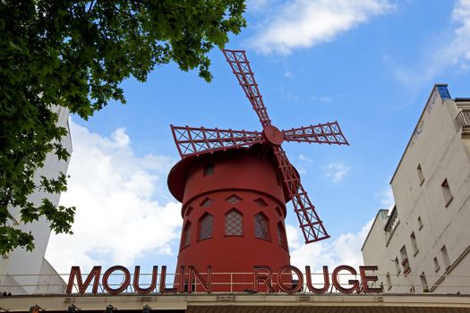 Moulin Rouge, a famous cabaret built in 1889, locating in the Paris red-light district of Pigalle.