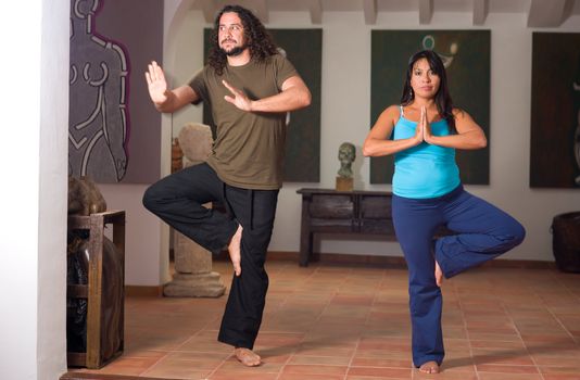 Clumsy yoga beginner about to lose  his balance