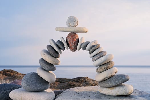 Arc crookedness of the pebbles on the seashore
