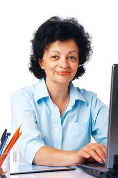 Elder woman using laptop on white background.