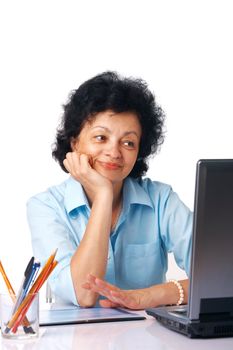 Elder woman looking on her laptop over white background.