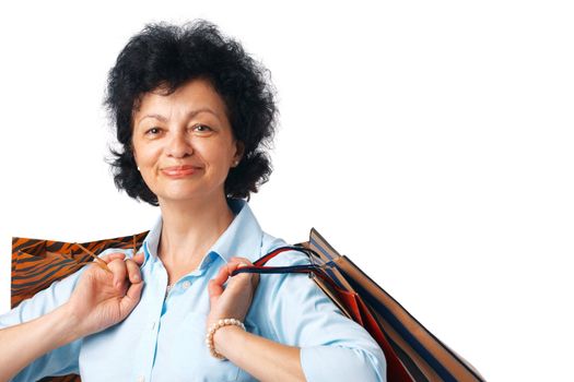 Close up portrait of elder woman with shopping bags.