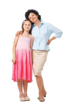 A full length portrait of grandmother embracing her grand daughter. 