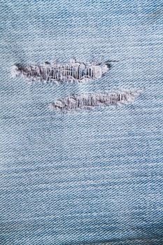 texture and pattern of rip blue jeans