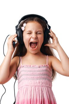 Little cute girl with headphones screaming on white background.