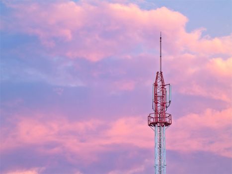 Cellular tower with twilight sky on background