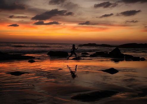 evening jogging on the beach of Indian ocean, Sri Lanka