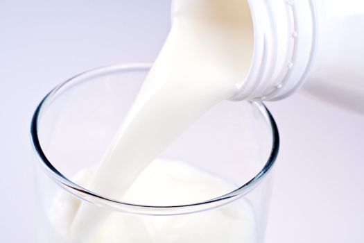 glass of milk with a bottle