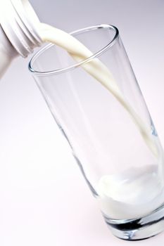 glass of milk with a bottle