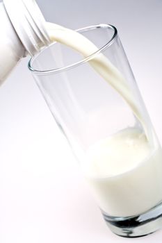 glass of milk with a bottle