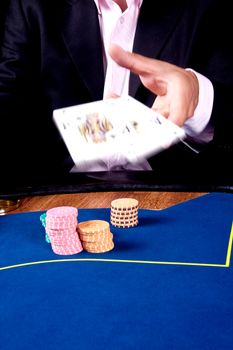 hands of a man with a card for the poker table