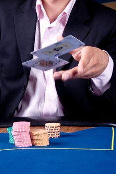 hands of a man with a card for the poker table