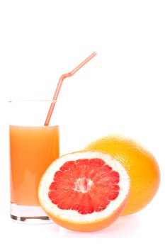 grapefruit and juice in glass on a white background