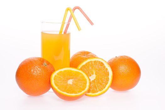 orange and juice in glass on a white background