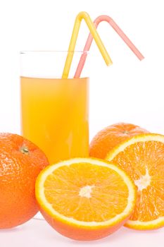 orange and juice in glass on a white background