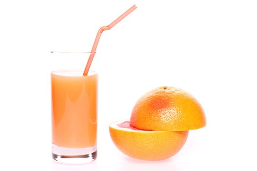 grapefruit and juice in glass on a white background