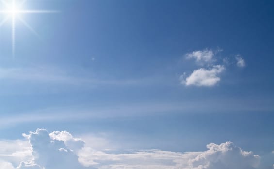 White fluffy clouds in the blue sky