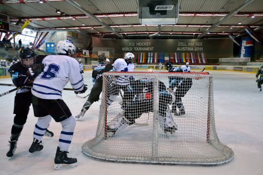 ZELL AM SEE, AUSTRIA - APRIL 30: Hockey world tournament. Scoring chance for Kiev at Bantam major final Black wings Linz (Austria) vs. Sokol-96 Kiev (Ukraine). Result 2:1 at the hockey rink of Zell am See at April 30, 2011. 