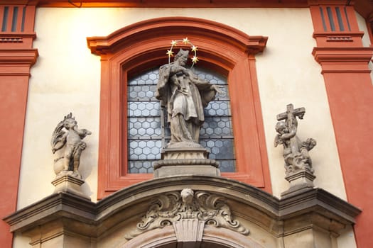 historic building, stucco on the walls, a statue