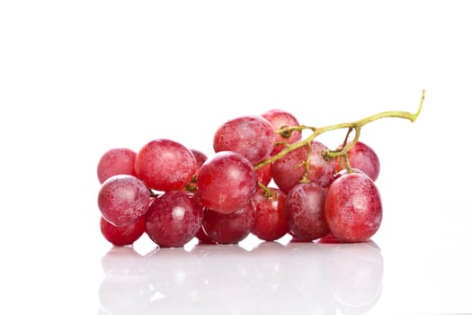 Fresh red grapes on white background