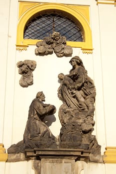 historic building, stucco on the walls, a statue