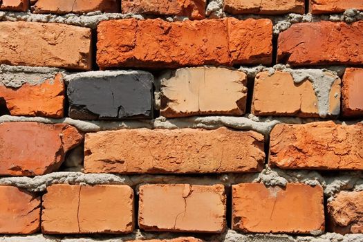 Detail of brick wall with bricks of different colors